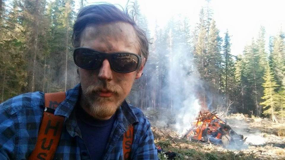 Man on lunch break during mountain pine beetle operations. 