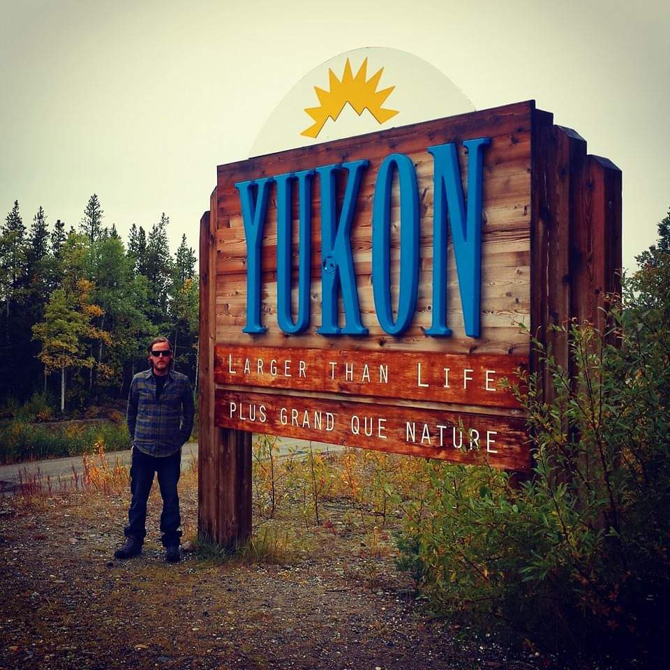 Nathan O'Reilley at the Yukon border sign.